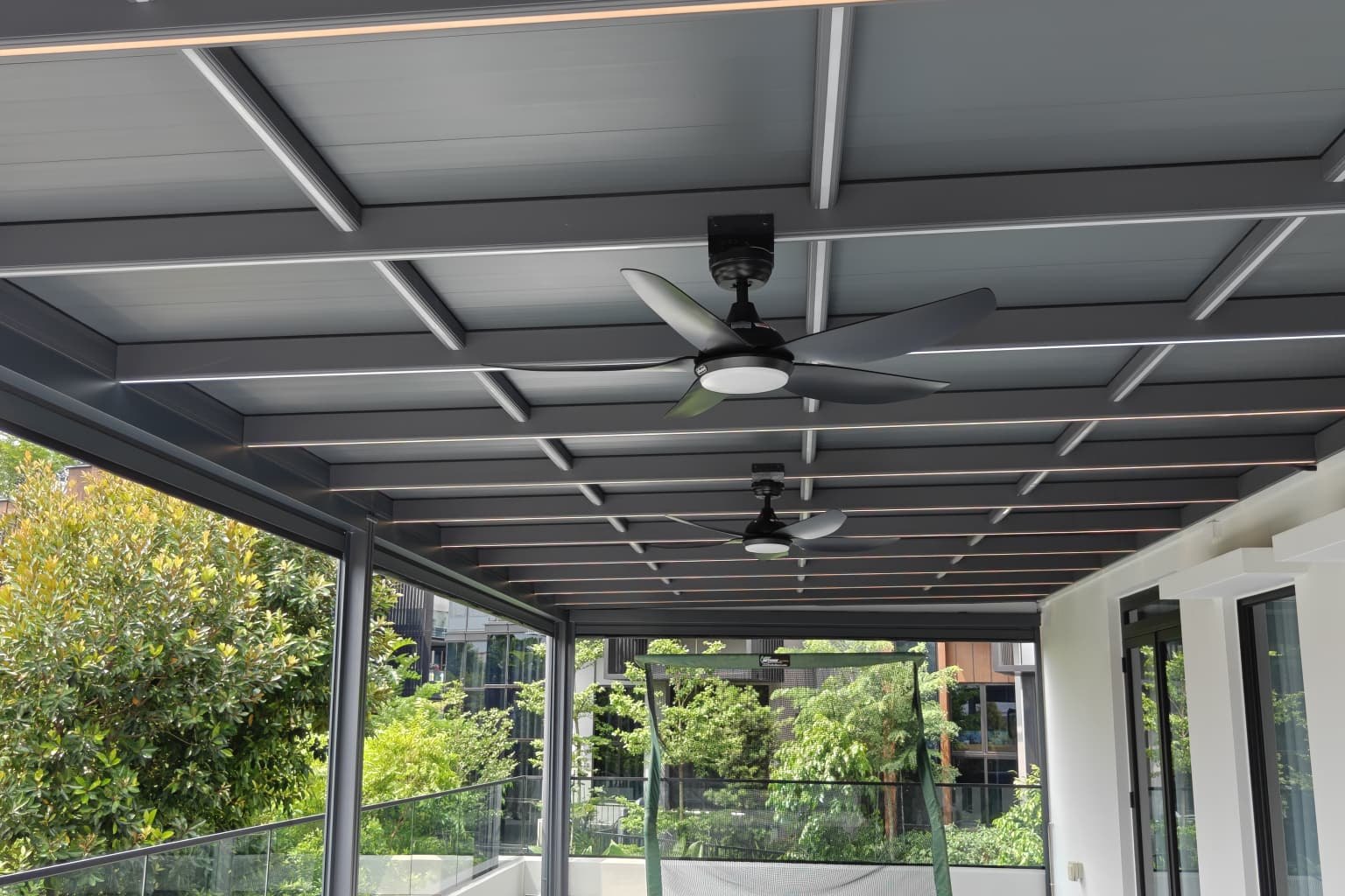Aluminium roof canopy over a Singapore landed home roof terrace